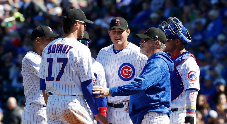 Chicago Cubs manager Joe Maddon visits the mound during the second inning of a spring training baseball game against the Texas Rangers, in Mesa, Ariz. AP DO NOT USE