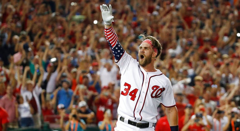 Washington Nationals Bryce Harper (34) reacts to his winning hit during the Major League Baseball Home Run Derby, in Washington. AP DO NOT USE