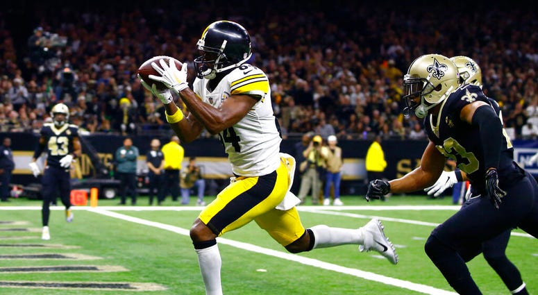 Pittsburgh Steelers wide receiver Antonio Brown (84) pulls in a pass reception in front of New Orleans Saints cornerback Marshon Lattimore, foreground right, and strong safety Kurt Coleman in the second half of an NFL football game in New Orleans. AP DO NOT USE