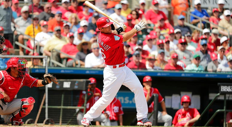 St. Louis Cardinals' Paul Goldschmidt, center, hits a double in the third inning during an exhibition spring training baseball game against the Washington Nationals on Monday, March 11, 2019, in Jupiter, Fla. AP DO NOT USE