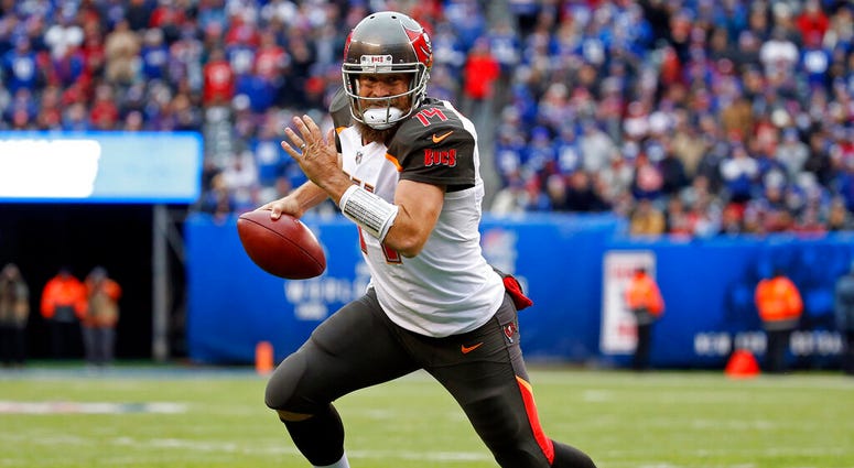 In this Nov. 18, 2018, file photo, Tampa Bay Buccaneers quarterback Ryan Fitzpatrick (14) rushes for a touchdown against the New York Giants during an NFL football game in East Rutherford, N.J. AP DO NOT USE