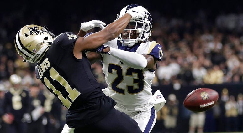 In this Jan. 20, 2019, file photo, Los Angeles Rams' Nickell Robey-Coleman (23) breaks up a pass intended for New Orleans Saints' Tommylee Lewis during the second half of the NFL football NFC championship game in New Orleans. AP DO NOT USE