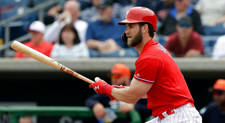 Philadelphia Phillies' Bryce Harper watches his single off Detroit Tigers starting pitcher Spencer Turnbull during the fourth inning of a spring training baseball game Wednesday, March 20, 2019, in Clearwater, Fla. AP DO NOT USE