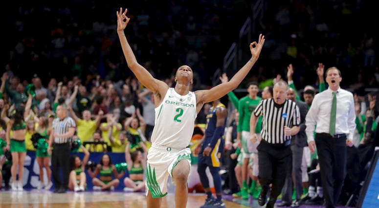 Oregon forward Louis King celebrates after scoring against UC Irvine during the second half of a second-round game in the NCAA men's college basketball tournament Sunday, March 24, 2019, in San Jose, Calif. AP DO NOT USE