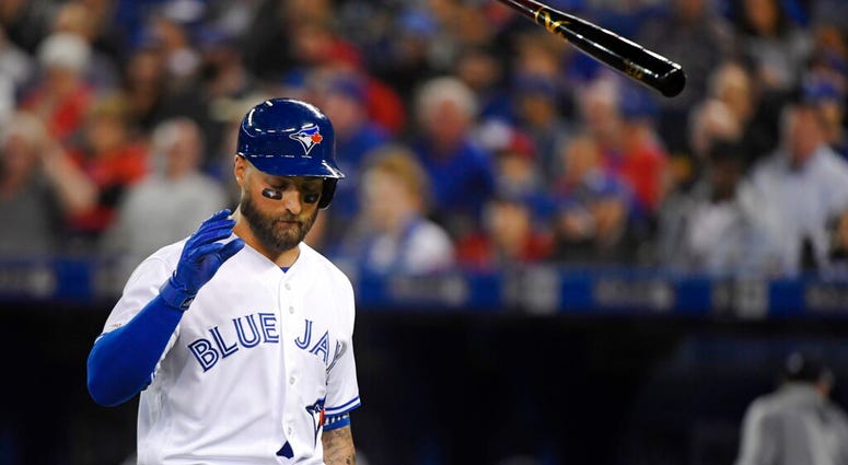Toronto Blue Jays' Kevin Pillar (11) tosses his bat after striking out during the fifth inning of a baseball game against the Detroit Tigers in Toronto, Thursday, March 28, 2019. AP DO NOT USE