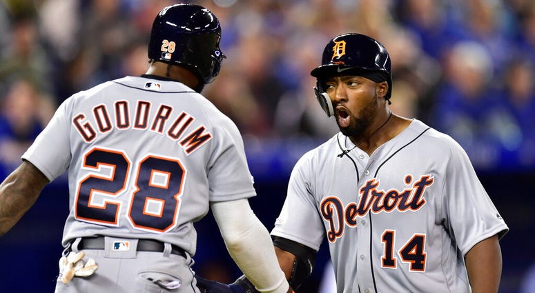 Detroit Tigers' Christin Stewart (14) celebrates his two-run home run with Niko Goodrum (28) during the 10th inning against the Toronto Blue Jays in a baseball game in Toronto, Thursday, March 28, 2019. AP DO NOT USE