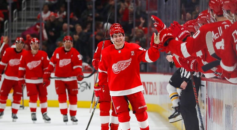 Detroit Red Wings left wing Taro Hirose greets the bench after scoring during the third period of an NHL hockey game against the Boston Bruins, Sunday, March 31, 2019, in Detroit. AP DO NOT USE