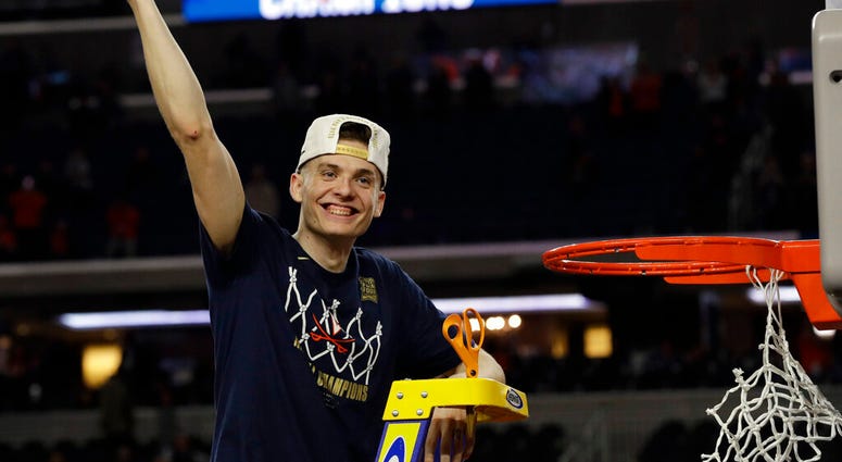 Virginia's Kyle Guy celebrate after defeating Texas Tech 85-77 in the overtime in the championship of the Final Four NCAA college basketball tournament, Monday, April 8, 2019, in Minneapolis. AP DO NOT USE