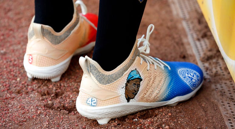 Texas Rangers' Delino DeShields wears shoes with Jackie Robinson's image prior to playing the Los Angels Angels in a baseball game Monday, April 15, 2019, in Arlington, Texas AP DO NOT USE