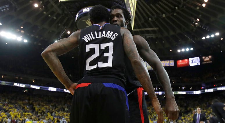 Los Angeles Clippers guard Lou Williams (23) celebrates with Patrick Beverley during the second half of Game 2 of a first-round NBA basketball playoff series against the Golden State Warriors in Oakland, Calif., Monday, April 15, 2019. AP DO NOT USE