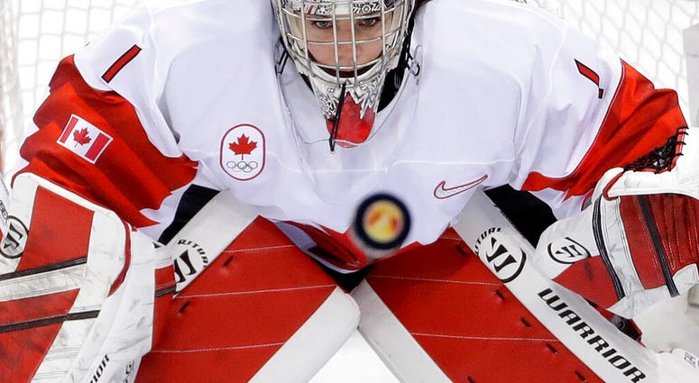 file photo, goalie Shannon Szabados (1), of Canada, stares at the flying puck during the second period of the women's gold medal hockey game against the United States at the 2018 Winter Olympics AP DO NOT USE