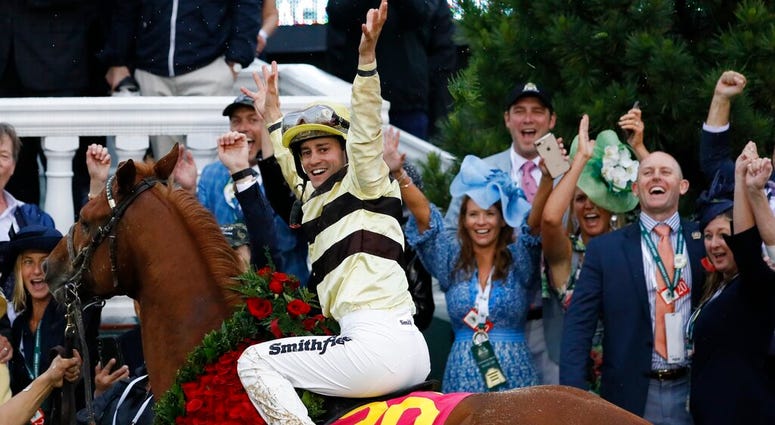 Flavien Prat celebrates after riding Country House to victory during the 145th running of the Kentucky Derby horse race at Churchill Downs Saturday, May 4, 2019, in Louisville, Ky. AP DO NOT USE