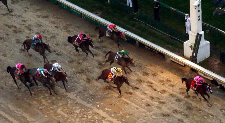 Luis Saez rides Maximum Security across the finish line first followed by Flavien Prat on Country House during the 145th running of the Kentucky Derby horse race at Churchill Downs Saturday, May 4, 2019, in Louisville, Ky. Country House was declared the w AP DO NOT USE