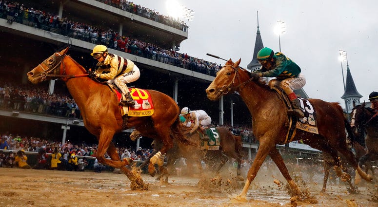 In this May 4, 2019, file photo, Flavien Prat rides Country House to the finish line during the 145th running of the Kentucky Derby horse race at Churchill Downs in Louisville, Ky AP DO NOT USE