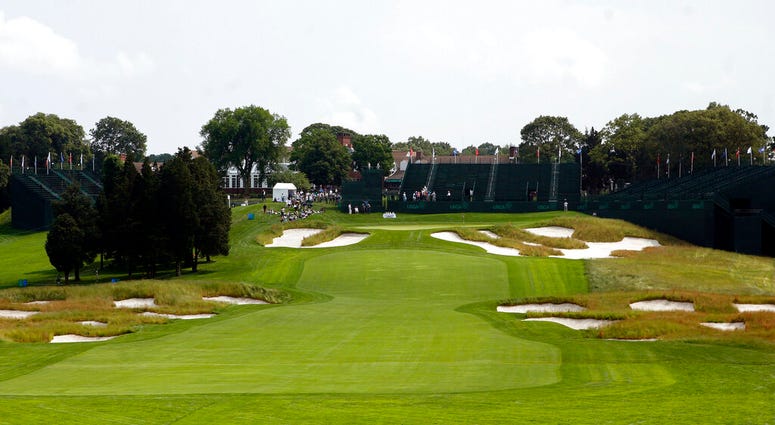 In this June 12, 2009, file photo, Bunkers line the fairway and protect the green on the 18th hole of Bethpage State Park's Black Course in Farmingdale, N.Y. AP DO NOT USE`