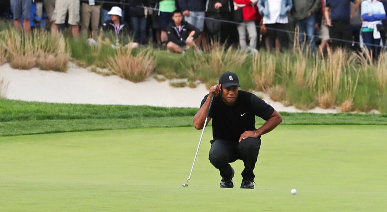 Tiger Woods lines up a putt on the 17th green during the second round of the PGA Championship golf tournament, Friday, May 17, 2019, at Bethpage Black in Farmingdale, N.Y. Tiger Woods lines up a putt on the 17th green during the second round of the PGA Championship golf tournament, Friday, May 17, 2019, at Bethpage Black in Farmingdale, N.Y.