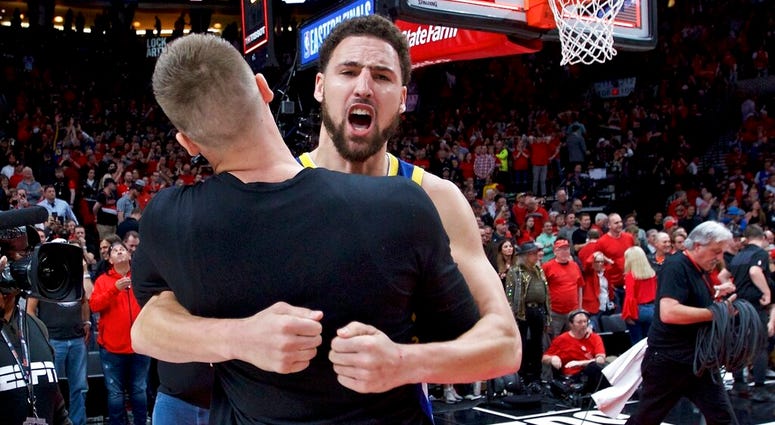 Golden State Warriors guard Klay Thompson hugs forward Jonas Jerebko at the end of Game 4 of the NBA basketball playoffs Western Conference finals against the Portland Trail Blazers Monday, May 20, 2019, in Portland, Ore. AP DO NOT USE