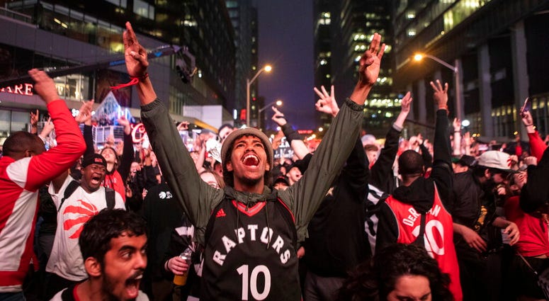 Toronto Raptors fans react as they watch Game 6 of the NBA basketball Eastern Conference finals between the Toronto Raptors and Milwaukee Bucks, on a screen outside Scotiabank Arena, in Toronto on Saturday, May 25, 2019. Toronto Raptors fans react as they watch Game 6 of the NBA basketball Eastern Conference finals between the Toronto Raptors and Milwaukee Bucks, on a screen outside Scotiabank Arena, in Toronto on Saturday, May 25, 2019.