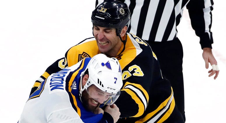 Boston Bruins defenseman Zdeno Chara (33) and St. Louis Blues left wing Pat Maroon (7) fight during the first period of an NHL hockey game, in Boston Boston Bruins defenseman Zdeno Chara (33) and St. Louis Blues left wing Pat Maroon (7) fight during the first period of an NHL hockey game, in Boston