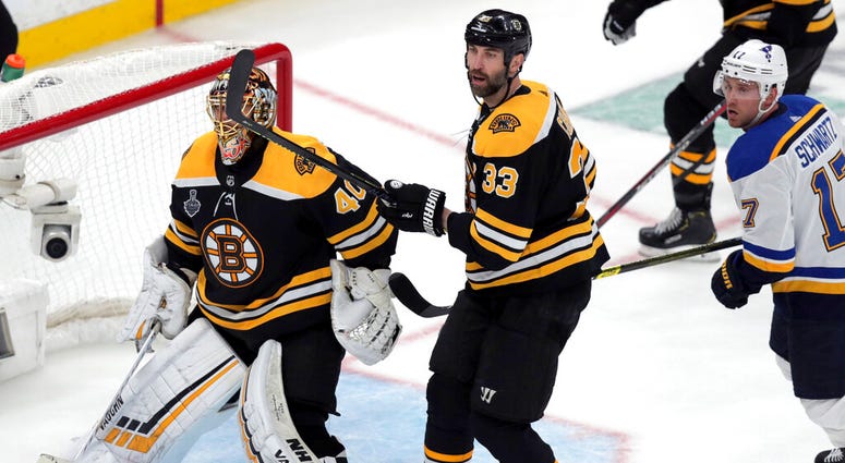 Boston Bruins goaltender Tuukka Rask (40), of Finland, and Zdeno Chara (33), of Slovakia, defend the net as St. Louis Blues' Jaden Schwartz, right, skates by during the third period in Game 1 of the NHL hockey Stanley Cup Final, Monday, May 27, 2019, in B Boston Bruins goaltender Tuukka Rask (40), of Finland, and Zdeno Chara (33), of Slovakia, defend the net as St. Louis Blues' Jaden Schwartz, right, skates by during the third period in Game 1 of the NHL hockey Stanley Cup Final, Monday, May 27, 2019, in B