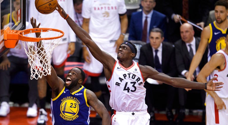 Toronto Raptors forward Pascal Siakam (43) blocks a shot by Golden State Warriors forward Draymond Green (23) during the second half of Game 1 of basketball’s NBA Finals, Thursday, May 30, 2019, in Toronto AP DO NOT USE