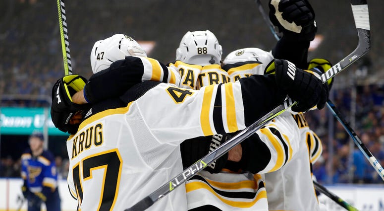 Boston Bruins right wing David Pastrnak (88), of the Czech Republic, celebrates after scoring against the St. Louis Blues during the third period of Game 6 of the NHL hockey Stanley Cup Final Sunday, June 9, 2019, in St. Louis. The Bruins won 5-1 to even AP DO NOT USE