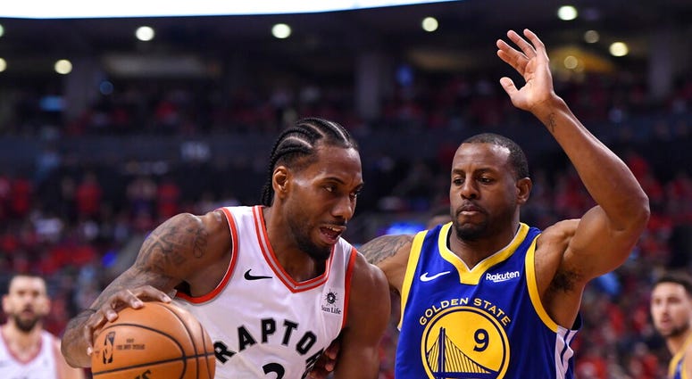 Toronto Raptors forward Kawhi Leonard (2) drives against Golden State Warriors forward Andre Iguodala (9) during second-half basketball action in Game 5 of the NBA Finals in Toronto, Monday, June 10, 2019. Toronto Raptors forward Kawhi Leonard (2) drives against Golden State Warriors forward Andre Iguodala (9) during second-half basketball action in Game 5 of the NBA Finals in Toronto, Monday, June 10, 2019.
