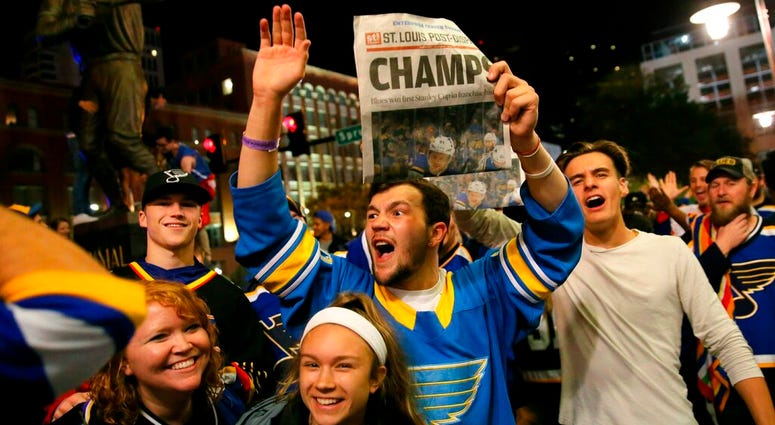 St. Louis Blues fans celebrate the team's victory over the Boston Bruins in Boston in Game 7 of the NHL hockey Stanley Cup Final, outside Busch Stadium in St. Louis after a watch party for the game was held in the baseball stadium Wednesday, June 12, 2019 St. Louis Blues fans celebrate the team's victory over the Boston Bruins in Boston in Game 7 of the NHL hockey Stanley Cup Final, outside Busch Stadium in St. Louis after a watch party for the game was held in the baseball stadium Wednesday, June 12, 2019