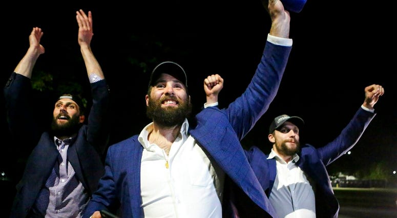 St. Louis Blues NHL hockey players Robert Bortuzo, left, Pat Maroon, center, and David Perron greet fans after arriving at the airport in St. Louis early Thursday, June 13, 2019. St. Louis Blues NHL hockey players Robert Bortuzo, left, Pat Maroon, center, and David Perron greet fans after arriving at the airport in St. Louis early Thursday, June 13, 2019.