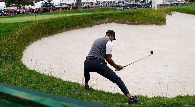 Tiger Woods hits out of the bunker on the 18th hole during the first round of the U.S. Open Championship golf tournament Thursday, June 13, 2019, in Pebble Beach, Calif. AP DO NOT USE