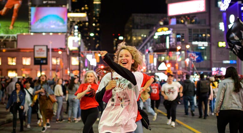 Toronto Raptors supporters celebrate in the streets after the Raptors defeated the Golden State Warriors during Game 6 NBA Finals to win the NBA Championship, in Toronto on Thursday, June 13, 2019. Toronto Raptors supporters celebrate in the streets after the Raptors defeated the Golden State Warriors during Game 6 NBA Finals to win the NBA Championship, in Toronto on Thursday, June 13, 2019.