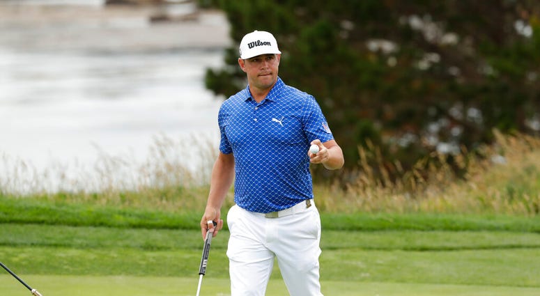 Gary Woodland waves after his putt on the fifth hole during the third round of the U.S. Open golf tournament Saturday, June 15, 2019, in Pebble Beach, Calif. Gary Woodland waves after his putt on the fifth hole during the third round of the U.S. Open golf tournament Saturday, June 15, 2019, in Pebble Beach, Calif.