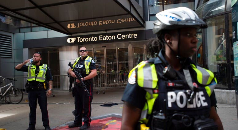 Toronto Police secure the scene where shots were fired during the Toronto Raptors NBA basketball championship parade in Toronto, Monday, June 17, 2019. Toronto Police secure the scene where shots were fired during the Toronto Raptors NBA basketball championship parade in Toronto, Monday, June 17, 2019.