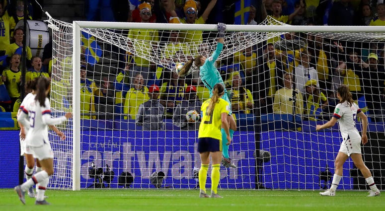 United States goalkeeper Alyssa Naeher punches the ball across the bar during the Women's World Cup Group F soccer match between Sweden and the United States at Stade Océane, in Le Havre, France, Thursday, June 20, 2019. United States goalkeeper Alyssa Naeher punches the ball across the bar during the Women's World Cup Group F soccer match between Sweden and the United States at Stade Océane, in Le Havre, France, Thursday, June 20, 2019.