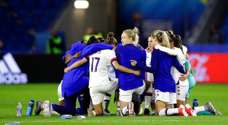 United States players embrace following their team's 2-0 win over Sweden in the Women's World Cup Group F soccer match at Stade Océane, in Le Havre, France, Thursday, June 20, 2019. United States players embrace following their team's 2-0 win over Sweden in the Women's World Cup Group F soccer match at Stade Océane, in Le Havre, France, Thursday, June 20, 2019.