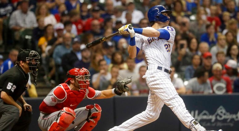 Milwaukee Brewers' Christian Yelich hits a two-run home run during the fifth inning of a baseball game against the Cincinnati Reds Friday, June 21, 2019, in Milwaukee. AP DO NOT USE
