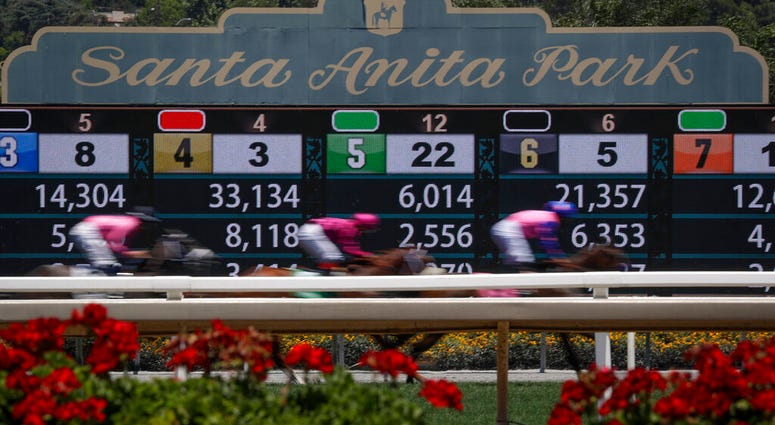 Horses finish the the first race during the last day of the winter/spring meet at the Santa Anita horse racing track Sunday, June 23, 2019, in Santa Anita, Calif. Horses finish the the first race during the last day of the winter/spring meet at the Santa Anita horse racing track Sunday, June 23, 2019, in Santa Anita, Calif.