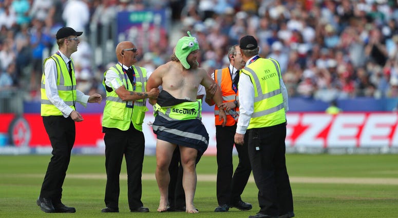 A streaker runs into the field during the Cricket World Cup match between New Zealand and England in Chester-le-Street, England, Wednesday, July 3, 2019. A streaker runs into the field during the Cricket World Cup match between New Zealand and England in Chester-le-Street, England, Wednesday, July 3, 2019.
