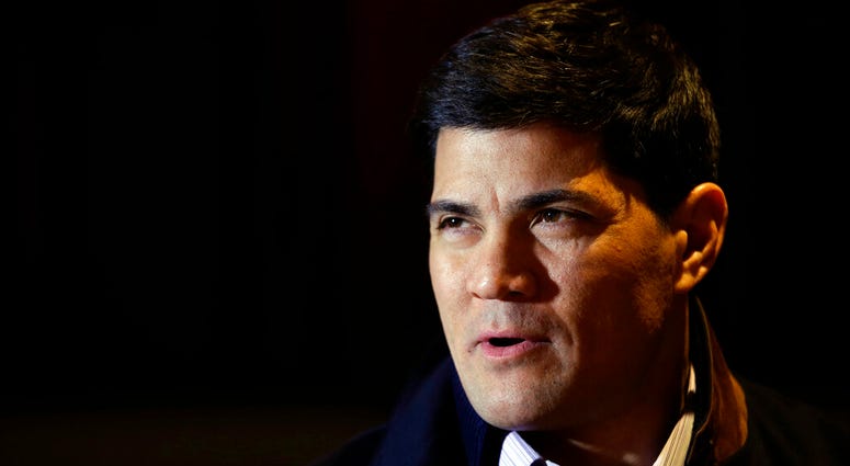 In this Jan. 29, 2014, file photo, Tedy Bruschi speaks during an interview at the NFL Super Bowl XLVIII media center in New York. AP DO NOT USE