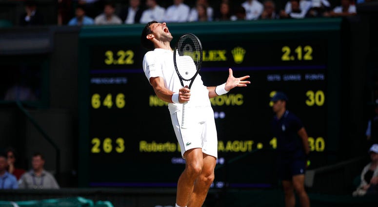Serbia's Novak Djokovic reacts as he plays against Spain's Roberto Bautista Agut in a Men's singles semifinal match on day eleven of the Wimbledon Tennis Championships in London, Friday, July 12, 2019. Serbia's Novak Djokovic reacts as he plays against Spain's Roberto Bautista Agut in a Men's singles semifinal match on day eleven of the Wimbledon Tennis Championships in London, Friday, July 12, 2019.