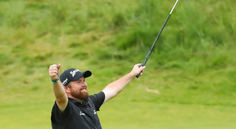 Ireland's Shane Lowry lifts his club to celebrate as he wins the British Open Golf Championships at Royal Portrush in Northern Ireland, Sunday, July 21, 2019. Ireland's Shane Lowry lifts his club to celebrate as he wins the British Open Golf Championships at Royal Portrush in Northern Ireland, Sunday, July 21, 2019.