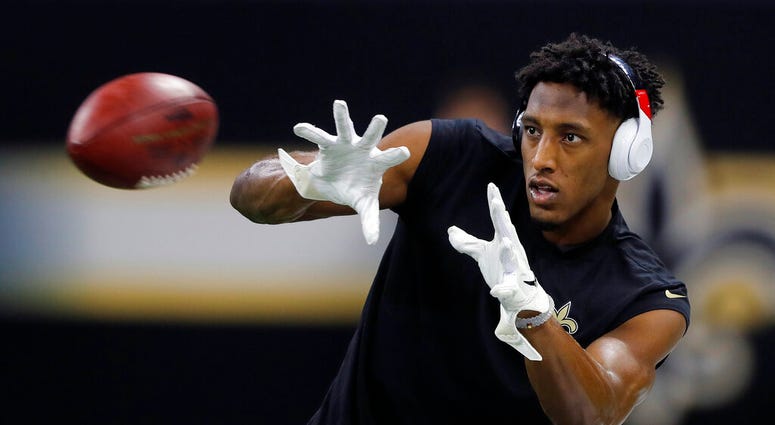 In this Sunday, Jan. 20, 2019 file photo, New Orleans Saints' Michael Thomas warms up before the NFL football NFC championship game against the Los Angeles Rams
