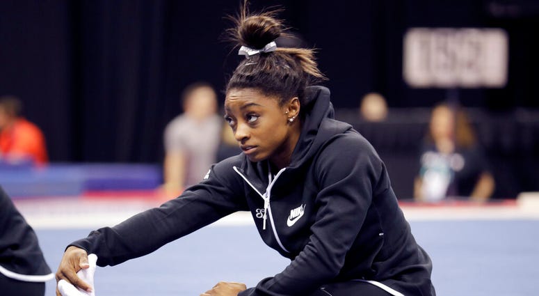 Simone Biles stretches during practice for the U.S. Gymnastics Championships Wednesday, Aug. 7, 2019, in Kansas City, Mo. Simone Biles stretches during practice for the U.S. Gymnastics Championships Wednesday, Aug. 7, 2019, in Kansas City, Mo.