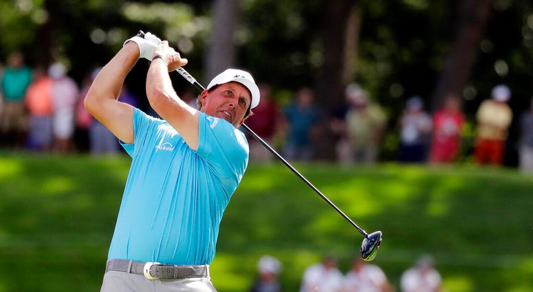 Phil Mickelson watches his tee shot on the 18th hole during the second round of the BMW Championship golf tournament at Medinah Country Club, Friday, Aug. 16, 2019, in Medinah, Ill. Phil Mickelson watches his tee shot on the 18th hole during the second round of the BMW Championship golf tournament at Medinah Country Club, Friday, Aug. 16, 2019, in Medinah, Ill.