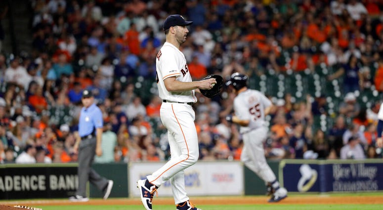 Houston Astros starting pitcher Justin Verlander walks off the mound after giving up a home run to Detroit Tigers' John Hicks (55) during the ninth inning of a baseball game Wednesday, Aug. 21, 2019, in Houston.