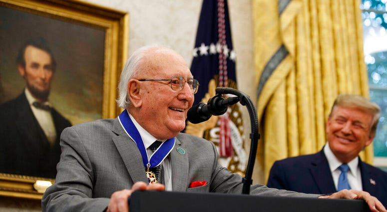 Former NBA basketball player and coach Bob Cousy, of the Boston Celtics, speaks as President Donald Trump smiles during a Presidential Medal of Freedom ceremony for Cousy, in the Oval Office of the White House, Thursday, Aug. 22, 2019, in Washington. Former NBA basketball player and coach Bob Cousy, of the Boston Celtics, speaks as President Donald Trump smiles during a Presidential Medal of Freedom ceremony for Cousy, in the Oval Office of the White House, Thursday, Aug. 22, 2019, in Washington.