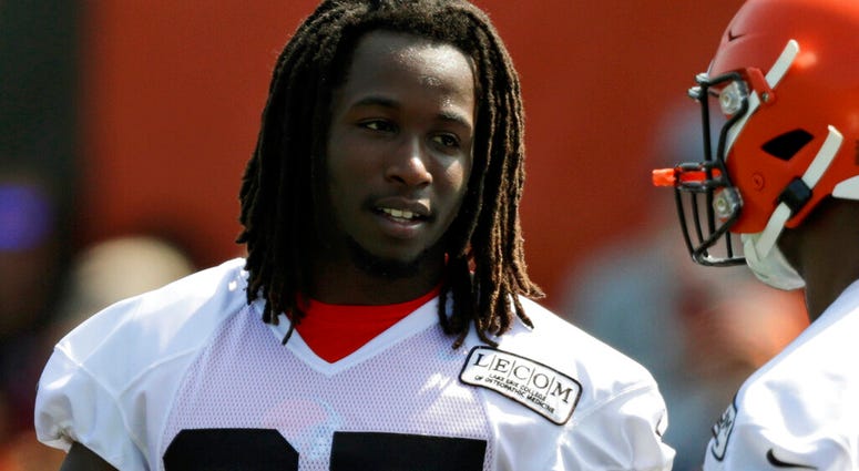 In this July 25, 2019, file photo, Cleveland Browns running back Kareem Hunt, left, talks with running back Nick Chubb during practice
