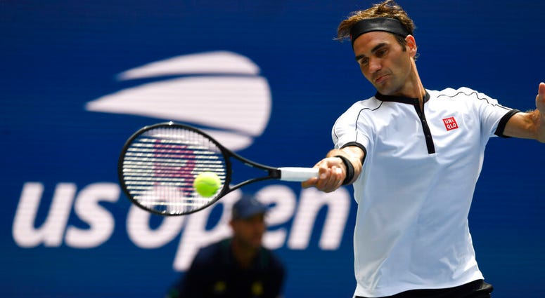 Roger Federer, of Switzerland, returns to David Goffin, of Belgium, during the fourth round of the US Open tennis championships Sunday, Sept. 1, 2019, in New York. AP DO NOT USE