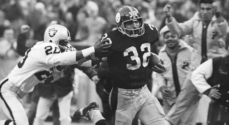 Immaculate Reception: Pittsburgh Steelers' Franco Harris eludes a tackle by Oakland Raiders' Jimmy Warren as he runs 42-yards for a touchdown after catching a deflected pass during an AFC Divisional NFL football playoff game in Pittsburgh. Immaculate Reception: Pittsburgh Steelers' Franco Harris eludes a tackle by Oakland Raiders' Jimmy Warren as he runs 42-yards for a touchdown after catching a deflected pass during an AFC Divisional NFL football playoff game in Pittsburgh.