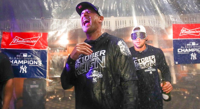 Hours after the startling news that pitcher Domingo Germán was placed on administrative leave under Major League Baseball's domestic violence policy, the homer-happy Yankees routed the Los Angeles Angels 9-1 Thursday night to wrap up first place and breez AP DO NOT USE